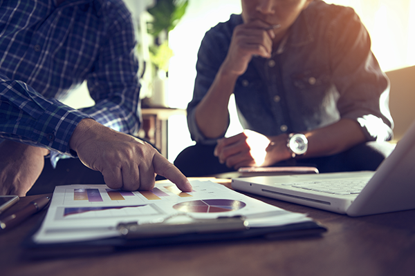 financial advisor showing client market returns